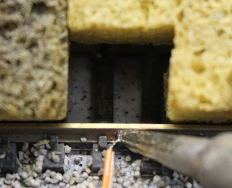 Solder power tap to train track